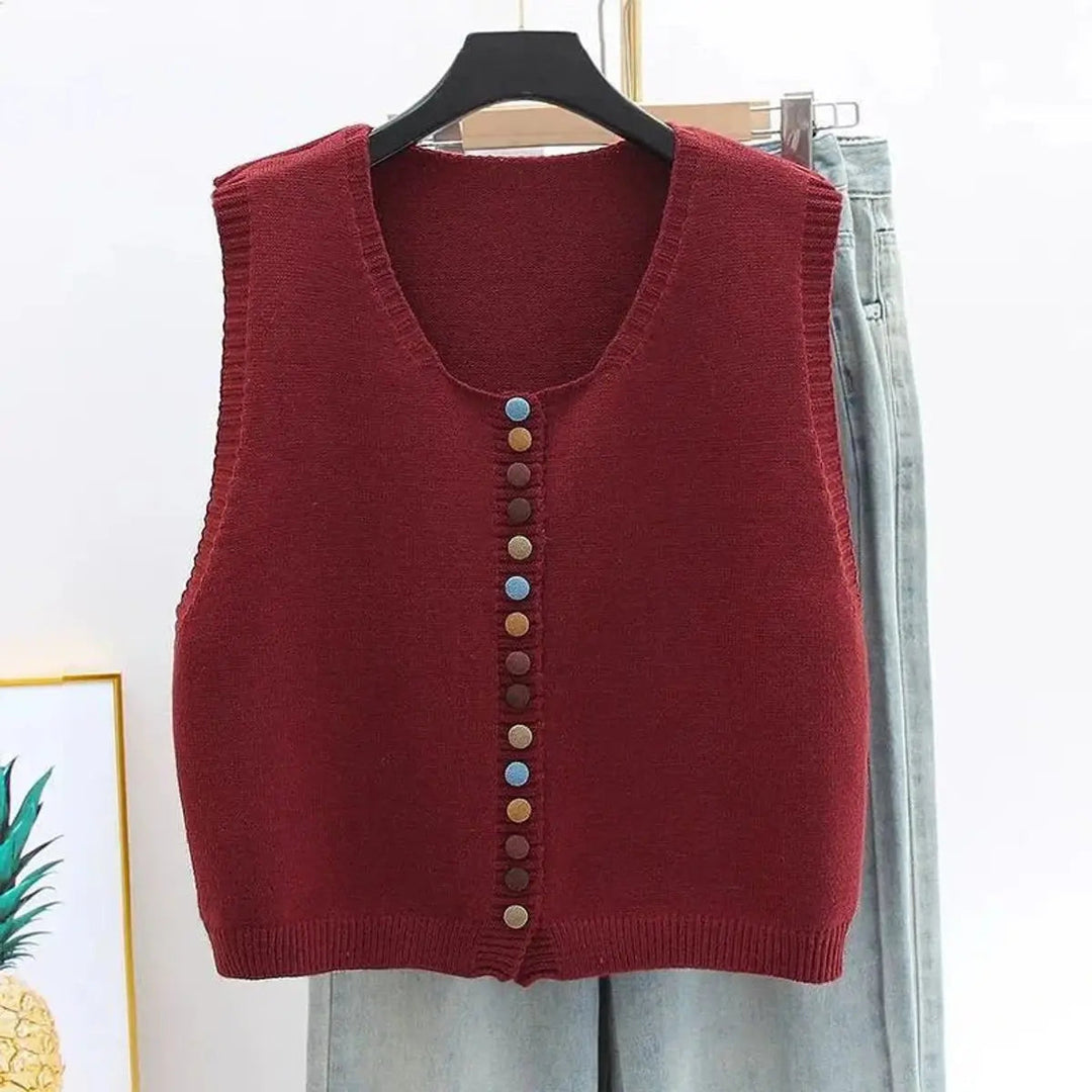 Versatile women's sleeveless vest. Button-front design with colorful buttons, perfect for all-season layering.
