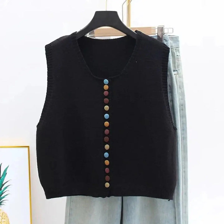 Chic women's button-front vest. Sleeveless cardigan vest featuring a round neck & stylish multi-color buttons.
