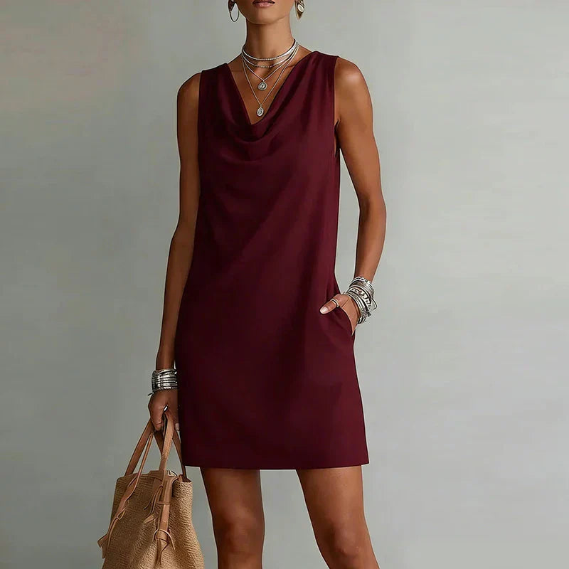 Comfortable sleeveless mini dress for women, featuring a chic cowl neck, ideal for summer styling.