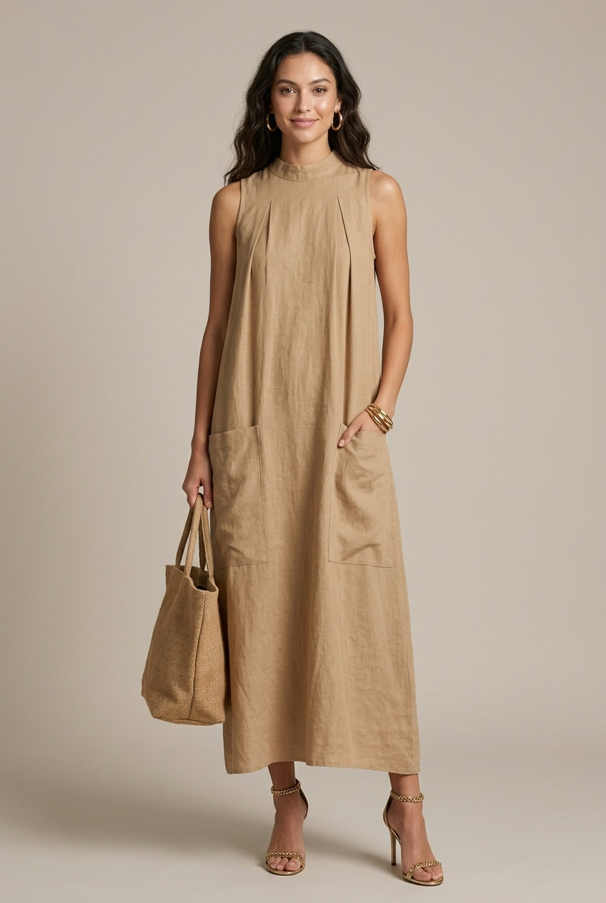 Women's sleeveless maxi dress with practical patch pockets, A-line cut, perfect for casual elegance.