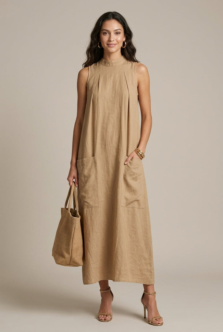 Women's sleeveless maxi dress with practical patch pockets, A-line cut, perfect for casual elegance.