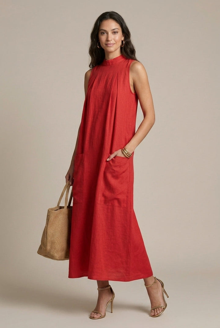 Women's sleeveless A-line maxi dress, flowy and comfortable, featuring useful patch pockets. Ideal for casual wear.