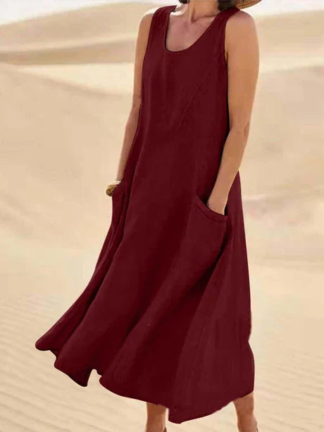 Women's sleeveless midi dress for summer, casual yet elegant, with convenient pockets.