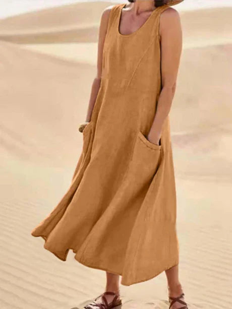 Comfortable women's summer dress, sleeveless midi length, with practical pockets for ease.