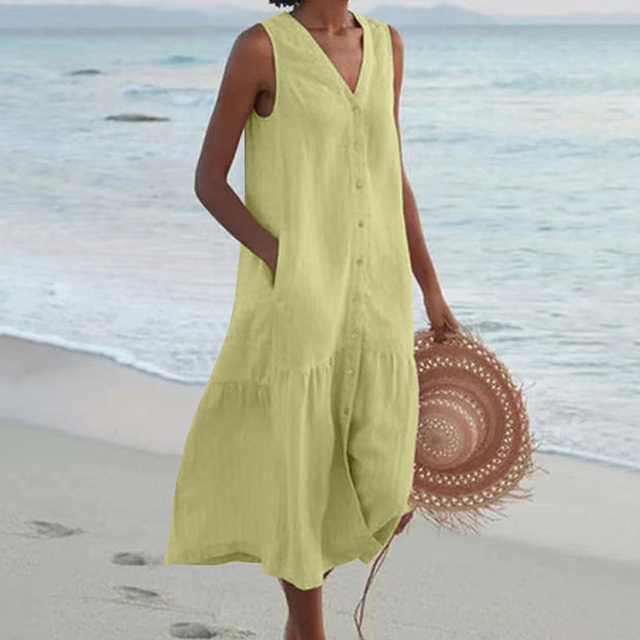 White sleeveless midi dress for women, featuring a flattering V-neck, button-front, and tiered skirt design.