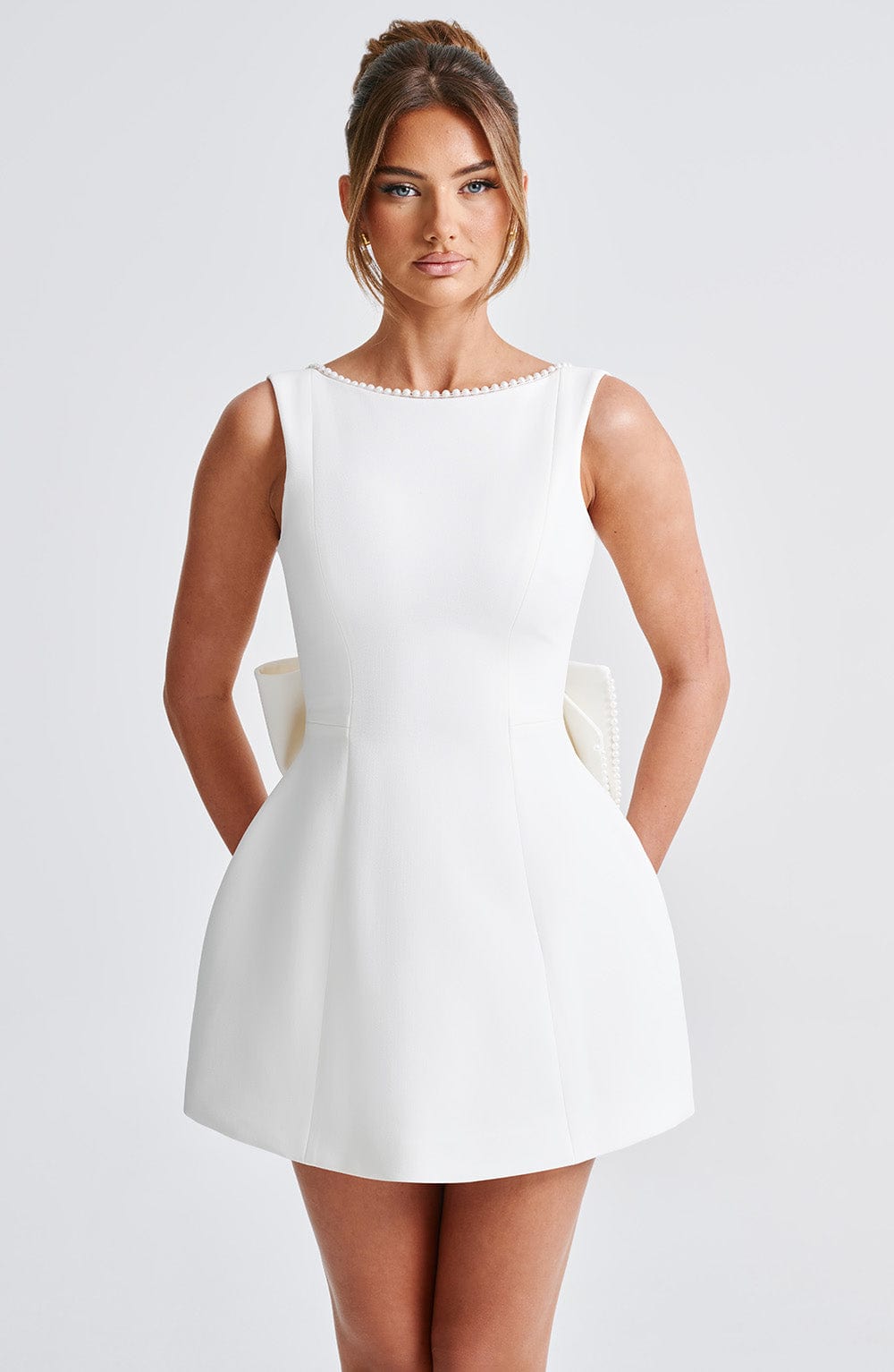 Elegant sleeveless mini dress, women's, with a stunning pearl neckline.