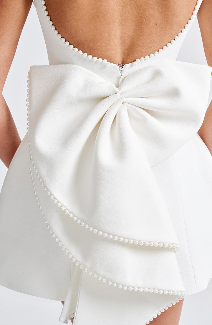 Occasion sleeveless mini dress, women's, with a beautiful pearl detailed neckline.