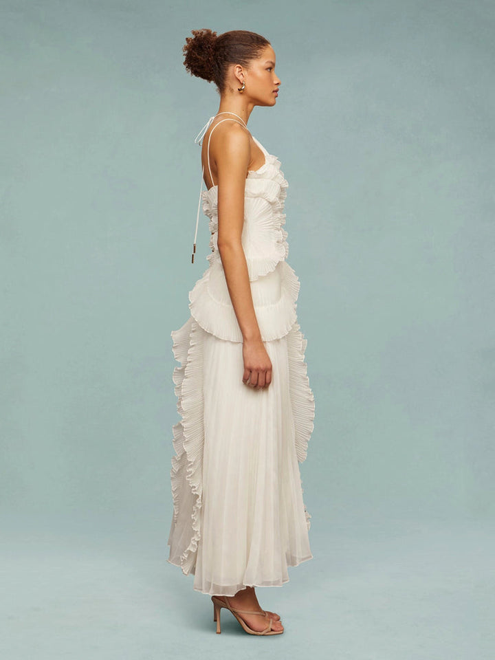Flowing women's sleeveless pleated maxi dress, an elegant choice for any wedding guest.