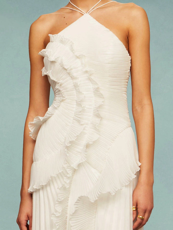 Modern asymmetric women's maxi dress, sleeveless with delicate pleats for wedding guests.