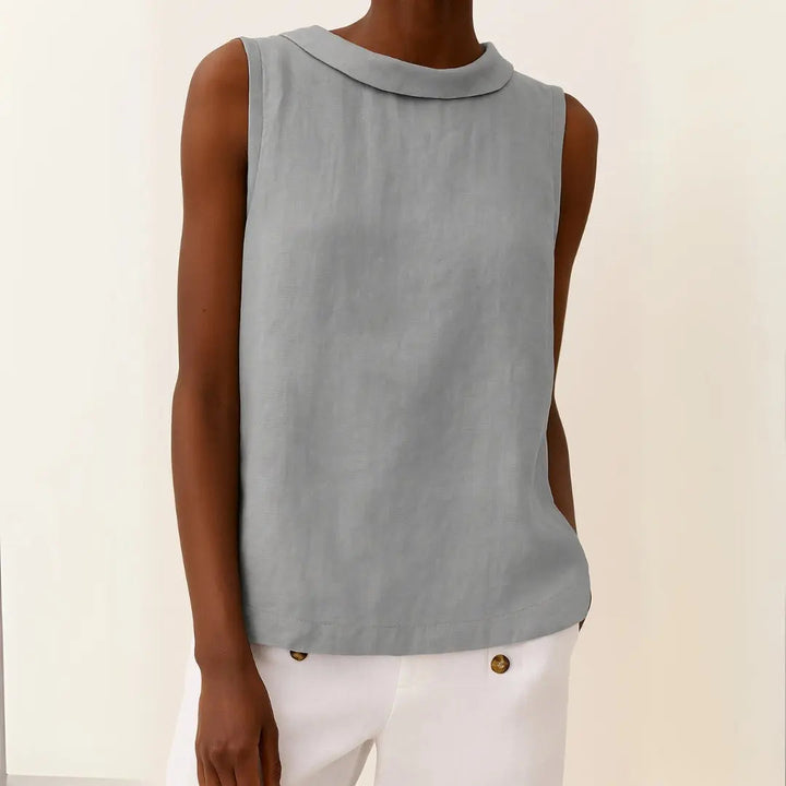 Women's sleeveless roll collar top, relaxed fit. Perfect for elegant, casual chic summer fashion.