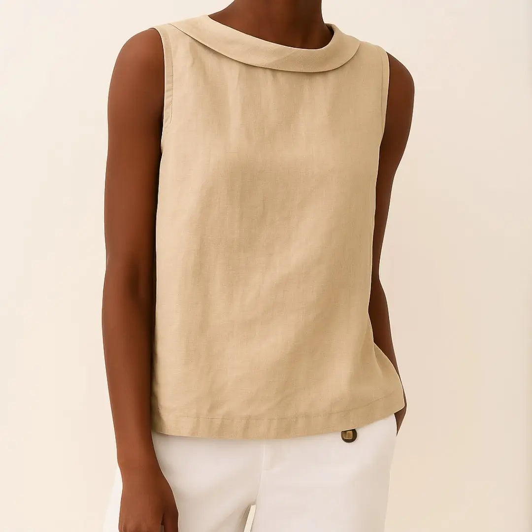 Elegant women's sleeveless top with a sophisticated roll collar and relaxed summer fit. Casual chic fashion.