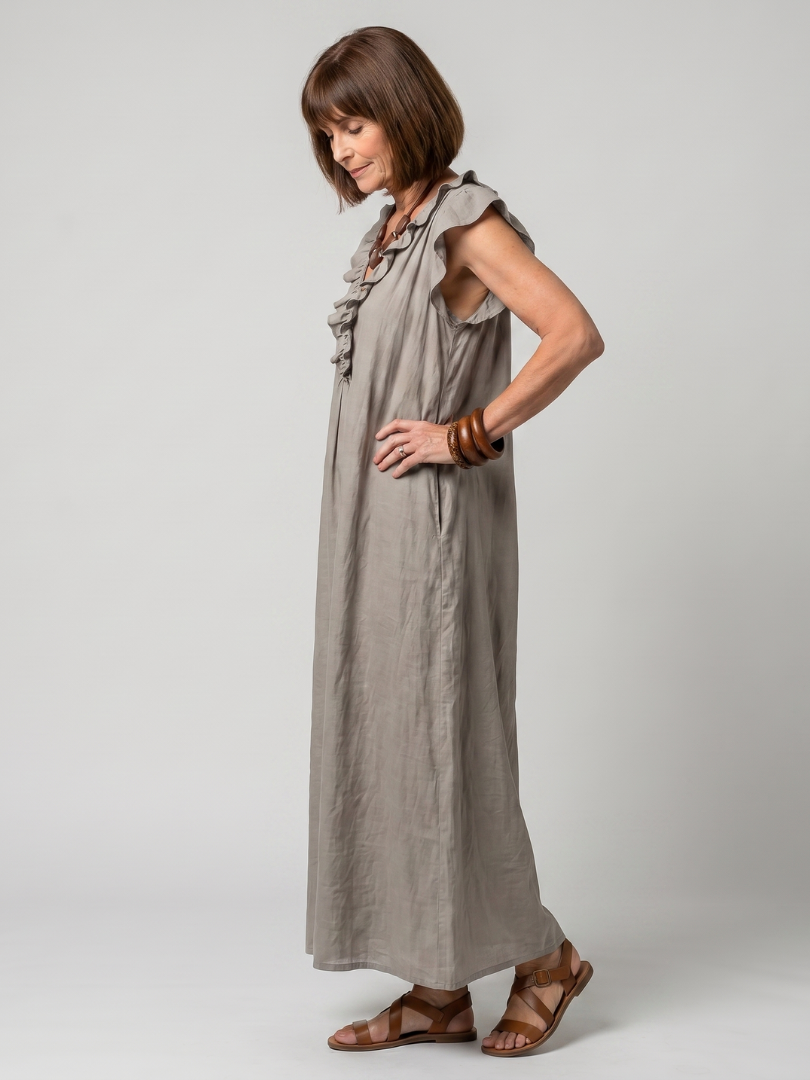 Elegant women's sleeveless midi dress with delicate ruffle trim, comfortable & stylish.
