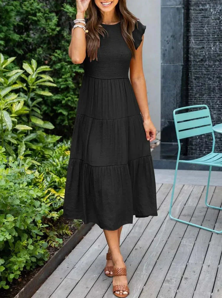 Close-up of smocked bodice on a women's sleeveless A-line midi dress, perfect for summer comfort.