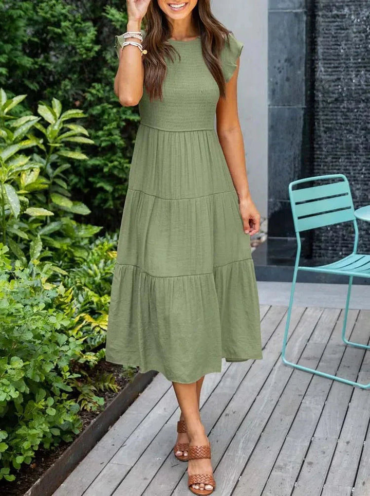 Comfortable summer sundress, a sleeveless smocked midi dress for casual outings or vacation.