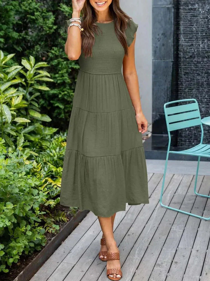 White smocked A-line midi sundress for women, sleeveless and flowy for hot summer days.