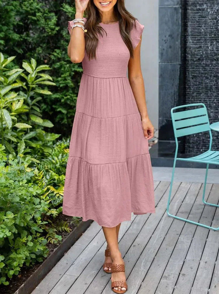 Perfect vacation smocked midi dress, sleeveless and a-line, providing a comfortable summer look.