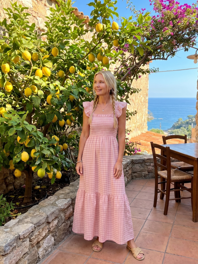 Patterned women's sleeveless square neck midi dress with a comfortable smocked gingham top.