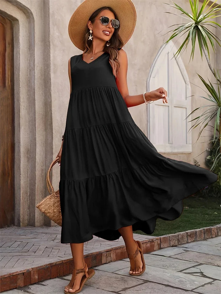 Beautiful women's tiered summer dress, sleeveless and flowy for beach days.