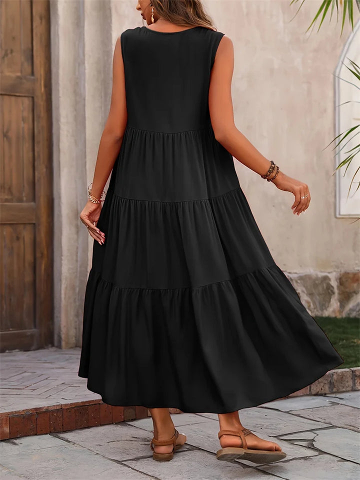Relaxed fit sleeveless maxi dress, perfect tiered style for warm weather.