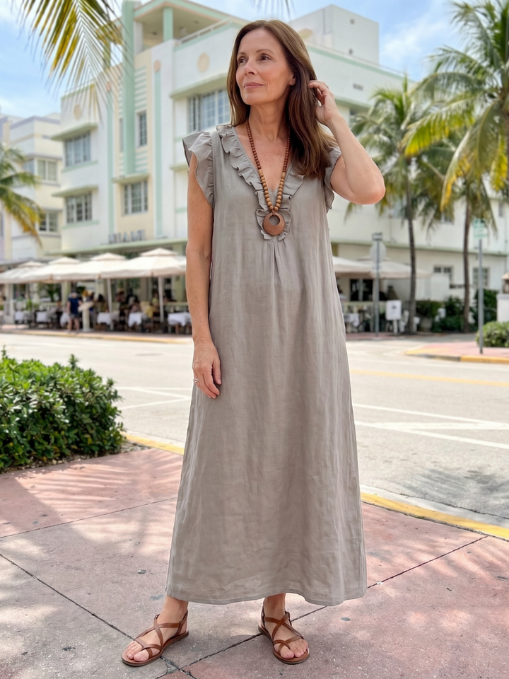 Comfortable women's V-neck midi dress, sleeveless, pull-on, featuring lovely ruffle detail.