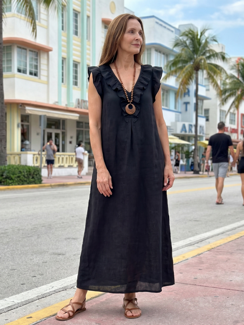 Relaxed fit women's midi dress, sleeveless V-neck, practical side pockets & elegant ruffle trim.