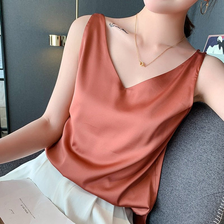 Soft, comfortable women's sleeveless V-neck top with an elegant drape, perfect for warm weather.
