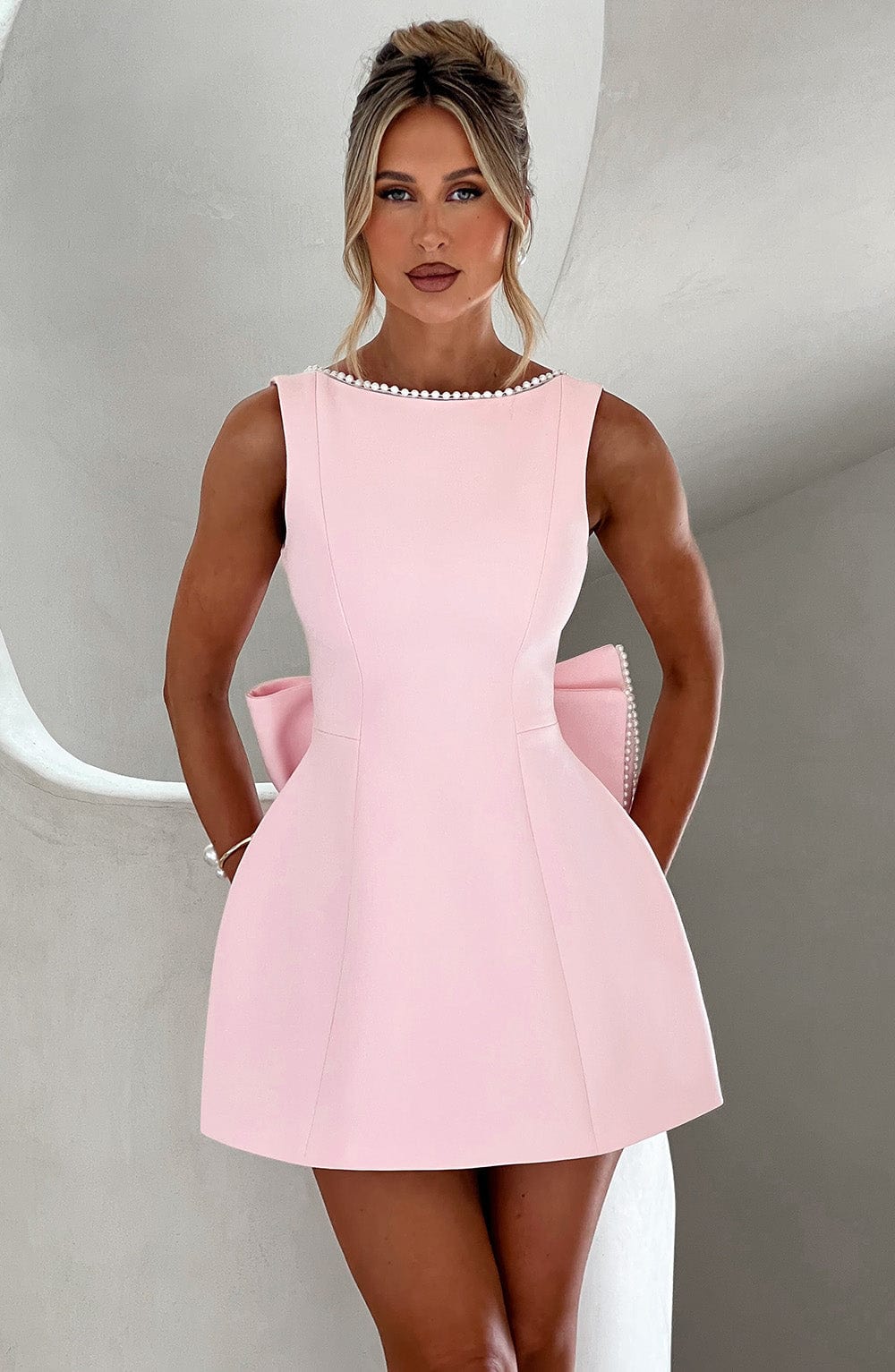 Women's sleeveless wedding guest mini dress, perfect for cocktail parties & formal events.