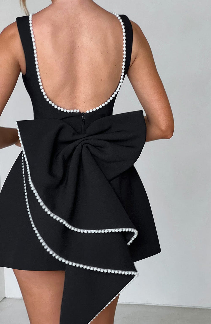 Sophisticated sleeveless mini dress for women, a graceful choice for wedding guests & formal parties.