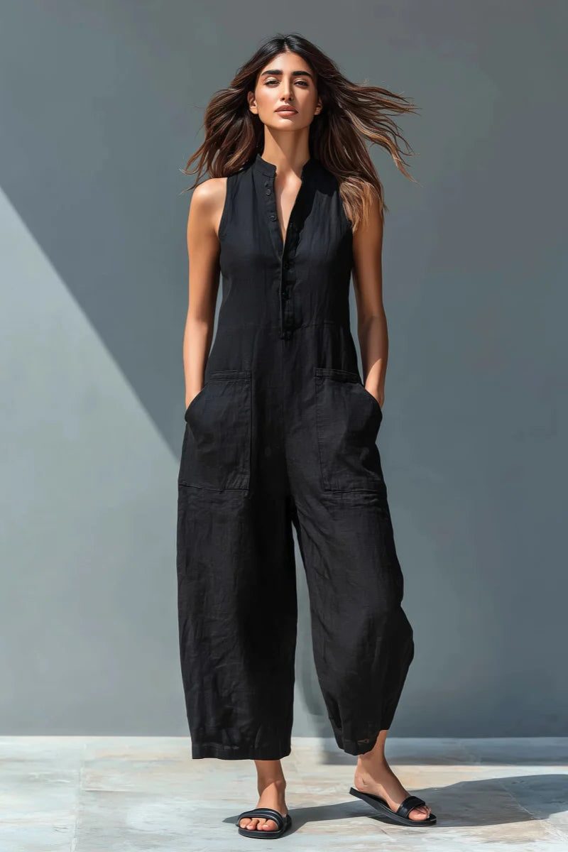 Women's sleeveless wide-leg jumpsuit with stand collar & button front for chic, comfortable casual wear.
