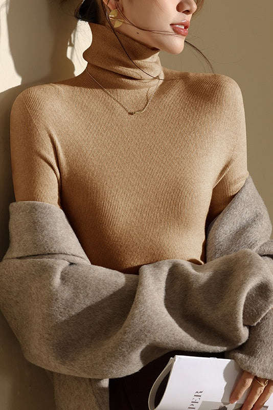 Warm seamless high-neck top for women, slim-fit silhouette, essential for fall and winter layering.