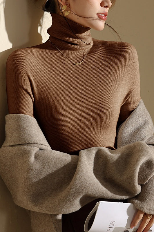 Versatile women's high-neck top, slim-fit & seamless. Great warm layer for casual or professional looks.