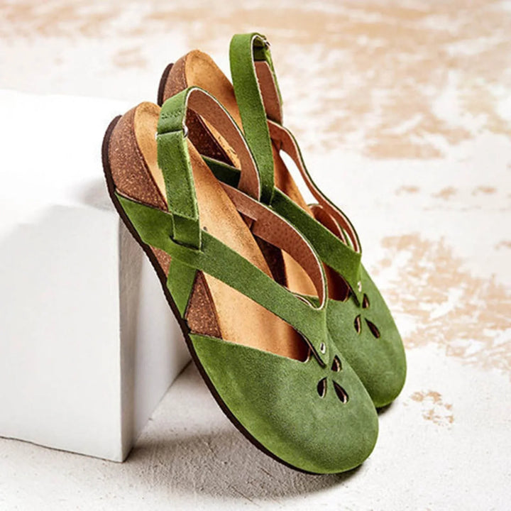 Women's slingback sandals with elegant floral cut-outs, closed toe, perfect for summer casual chic style.