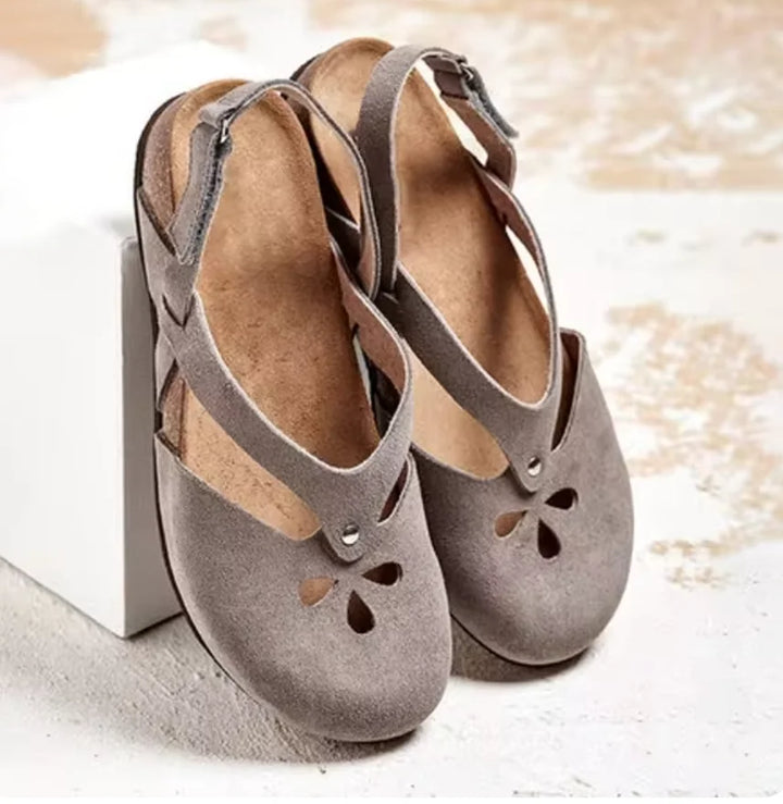 Chic women's slingback sandals, slip-on with stylish floral cut-outs and a secure closed toe for summer.