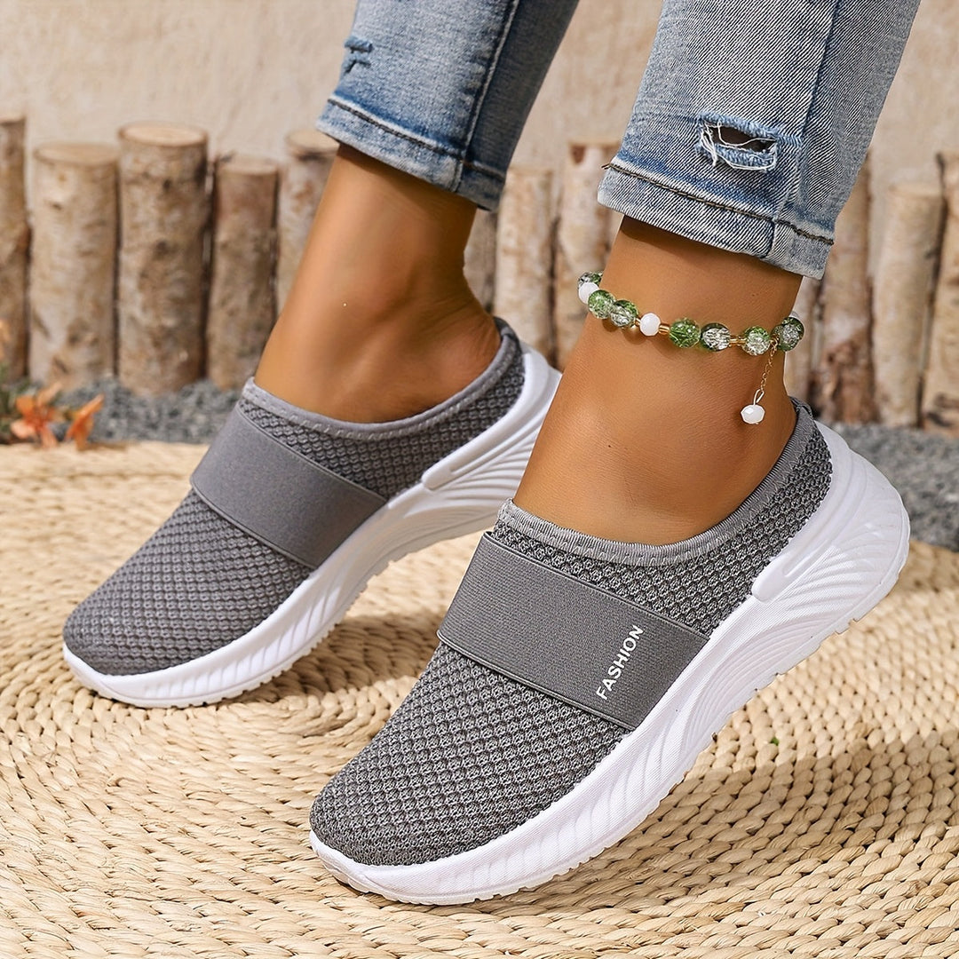 Comfortable women's walking slip-ons, mesh construction for breathable summer wear.