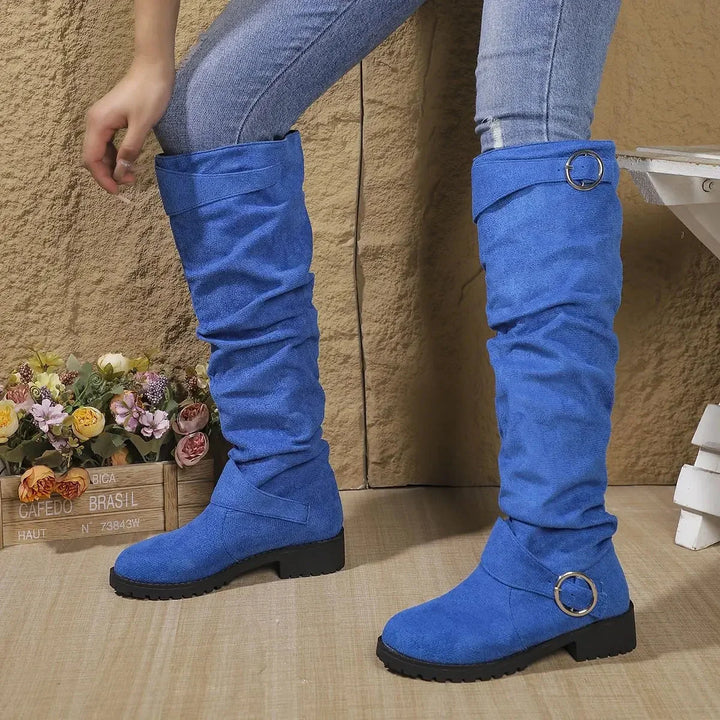 On-trend women's slouchy knee-high boots, featuring a stylish buckle and a modern lug sole for fall fashion.