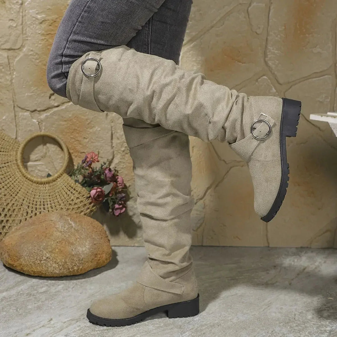 Stylish women's slouchy knee-high boots. Features a chic buckle, comfortable design & sturdy lug sole for fall/winter.