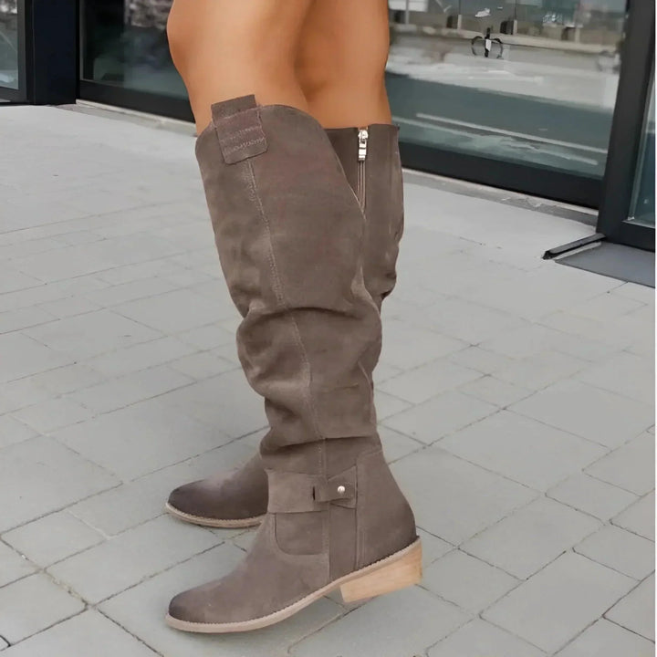 Chic women's pointed-toe slouchy boots, knee-high style with easy side zipper, versatile fashion footwear.