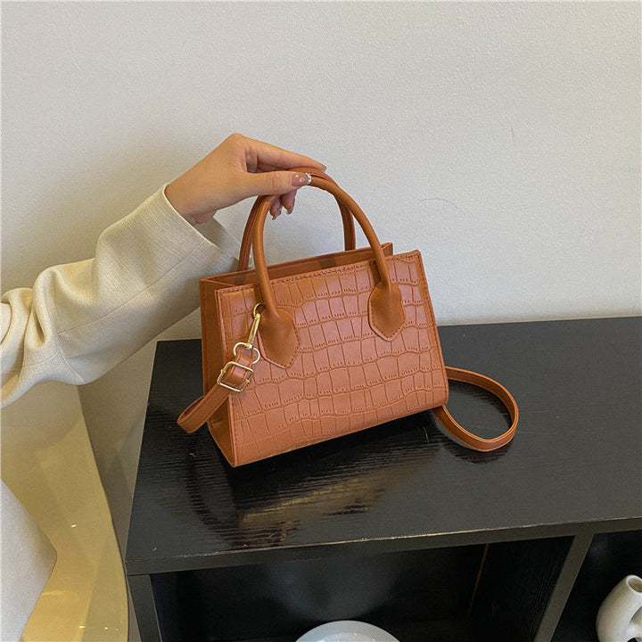 Versatile women's small khaki clutch handbag for daily use, a chic fashion accessory.