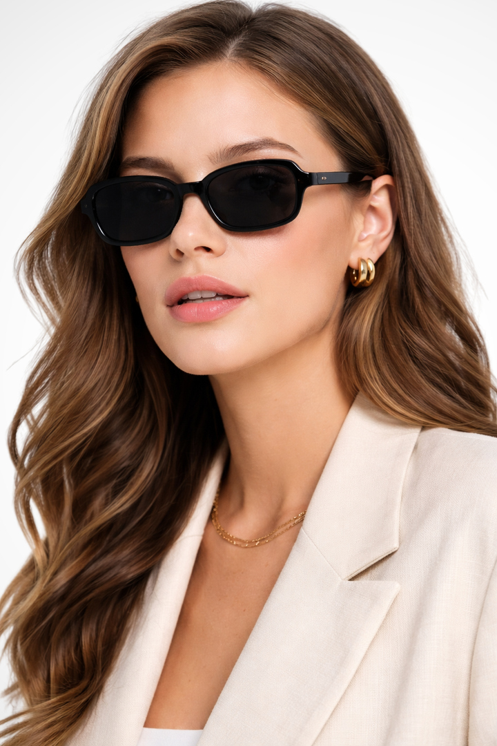 Women's small narrow rectangle retro sunglasses with tinted lenses. Stylish fashion eyewear accessory.