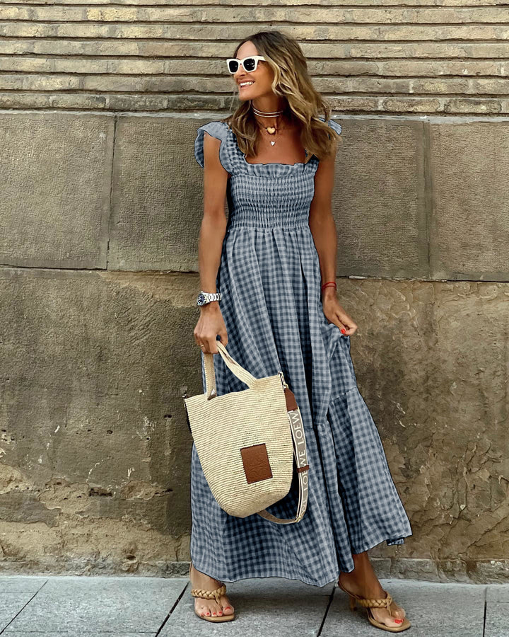 Red gingham smocked & tiered maxi dress. Women's flowy summer dress, ideal for casual and vacation.