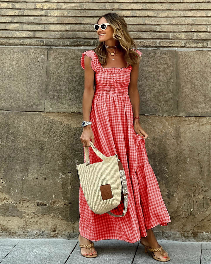Flowy smocked tiered maxi dress. Gingham pattern, ideal women's casual day dress or spring vacation.