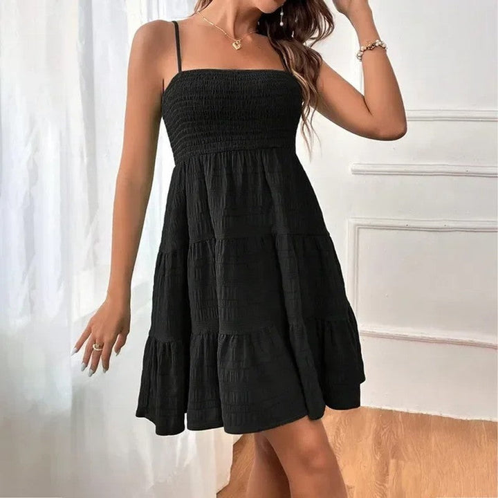 Lightweight smocked tiered mini sundress, women's summer fashion, breezy & comfortable for warm days.