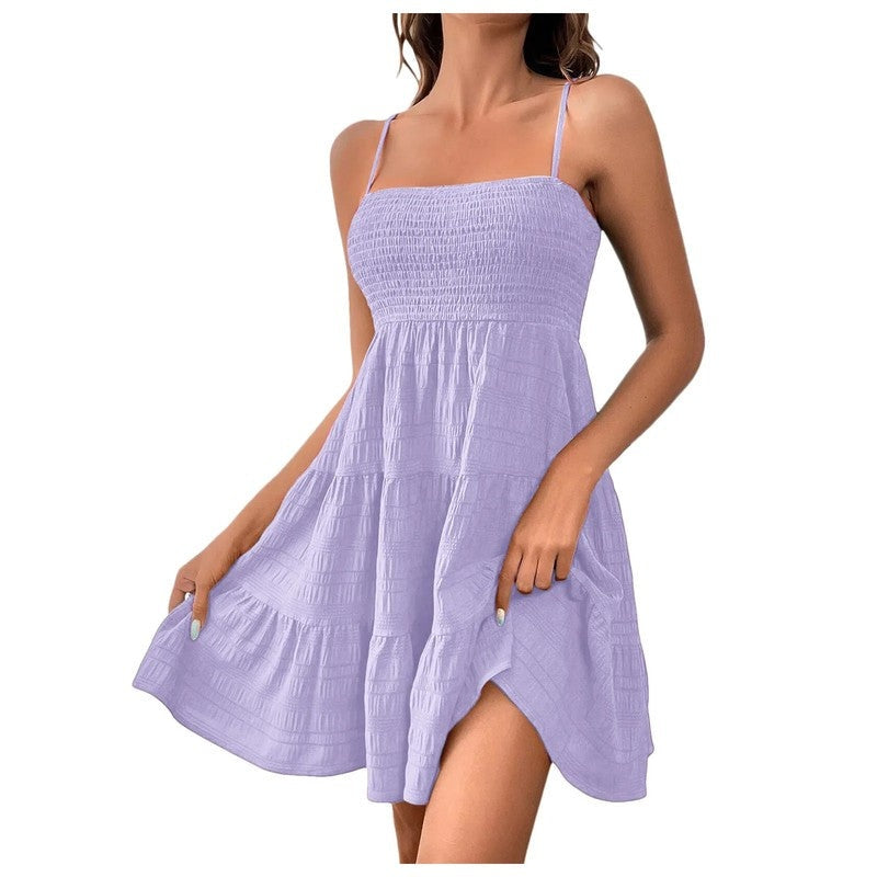 Comfortable women's smocked tiered mini sundress, sleeveless design for ultimate summer relaxation.