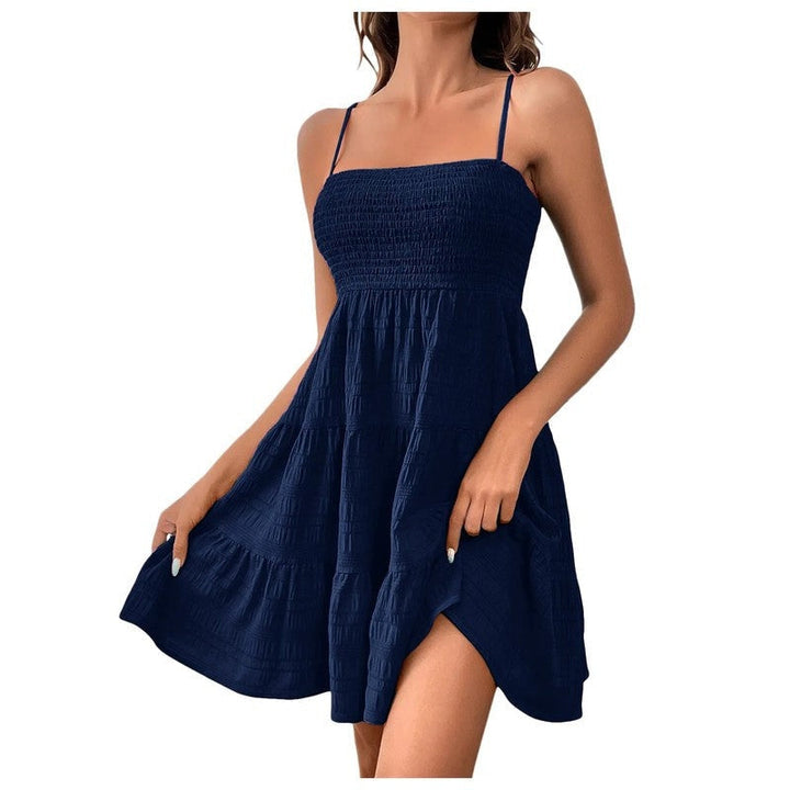 Trendy smocked tiered mini sundress, perfect vacation dress, effortless women's summer style.