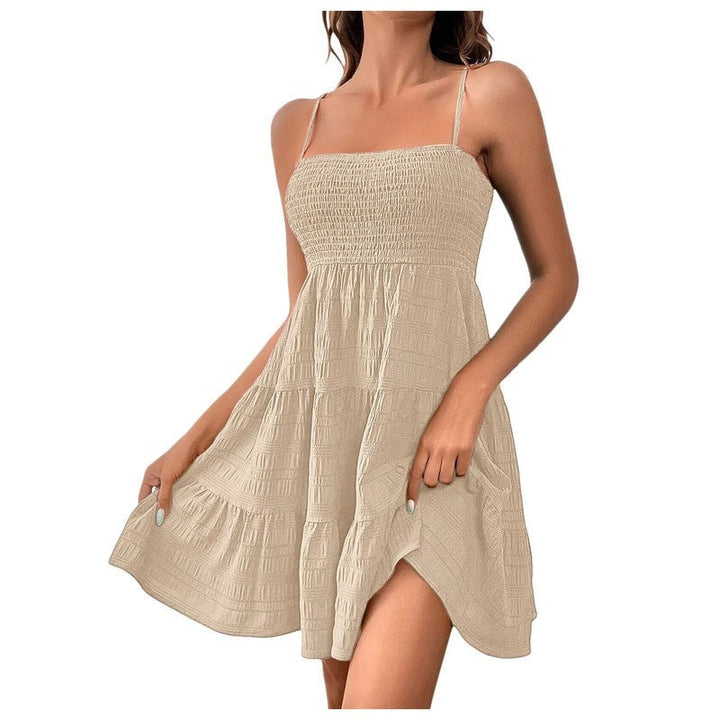 Relaxed fit smocked mini sundress, tiered and sleeveless, chic casual summer dress for women.