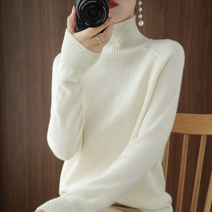 Comfortable smooth feel women's turtleneck pullover. A chic long-sleeve top for minimalist everyday fashion.