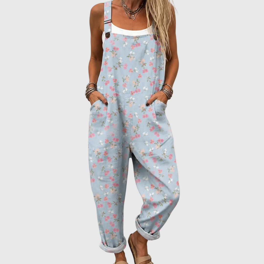 Women's soft blue floral jumpsuit, comfortable & loose-fit with pockets, perfect for summer casual or elegant wear.
