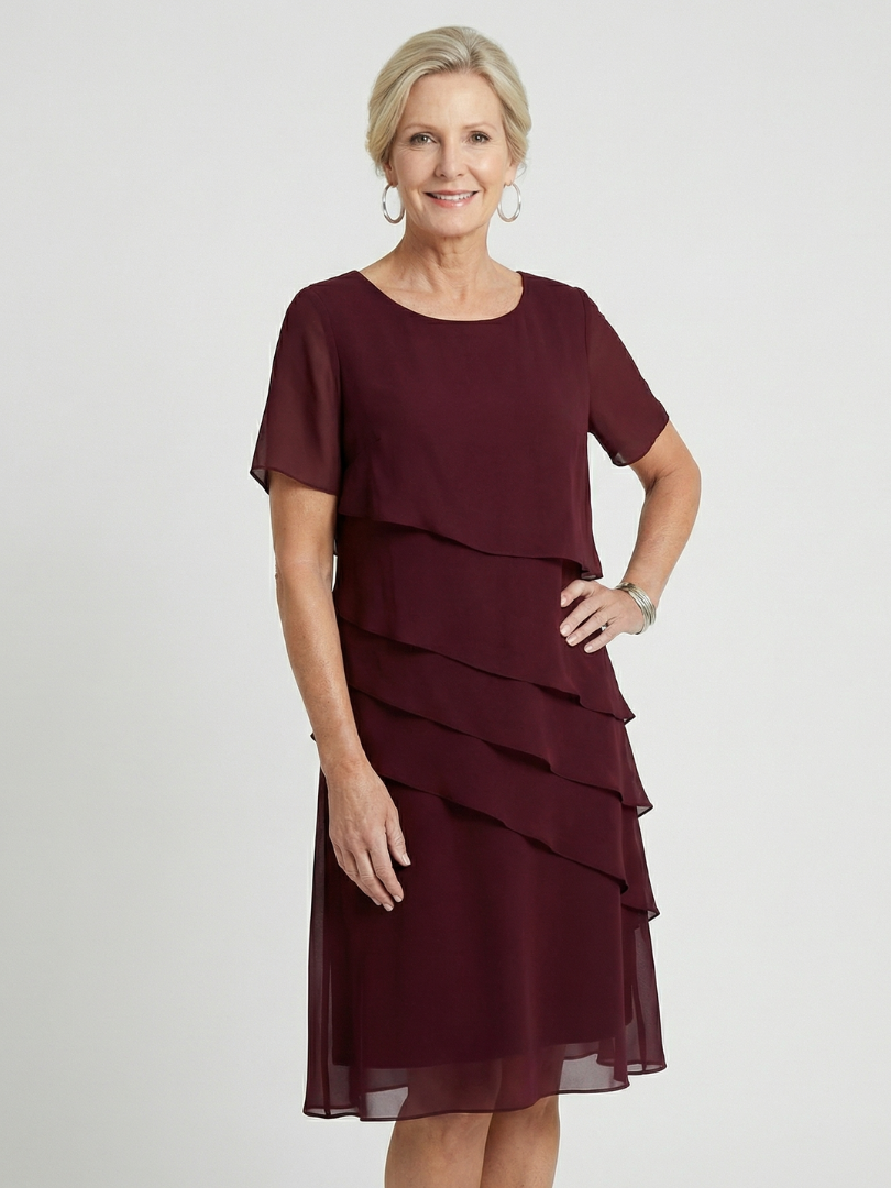 Stylish women's knee length contour dress with short sleeves, round neck, offering relaxed fit & comfort.