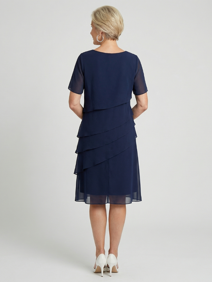 Relaxed fit women's soft contour knee length dress, short sleeve, round neck, offering elegant comfort.