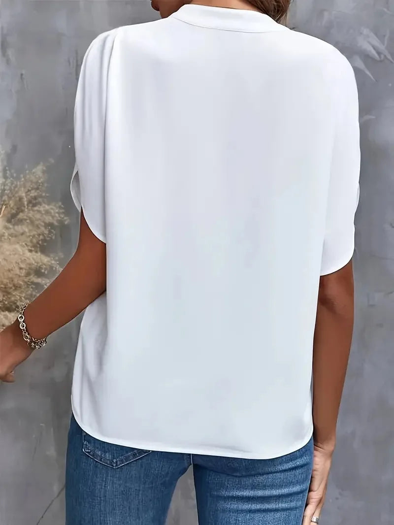 Chic women's long sleeve V-neck blouse with a relaxed fit, ideal for fashionable layering.
